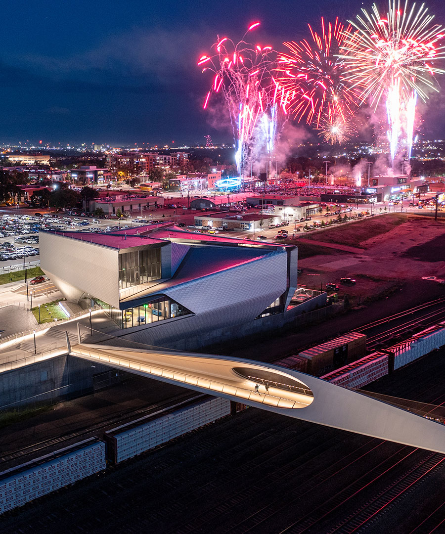 Fireworks behind downtown Colorado Springs walking bridge