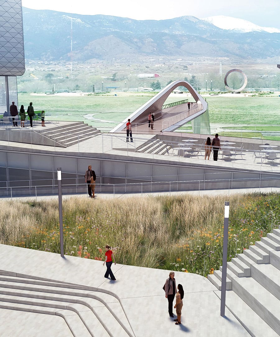 Groups of people utilize the plaza of the Colorado Springs US Olympic Museum