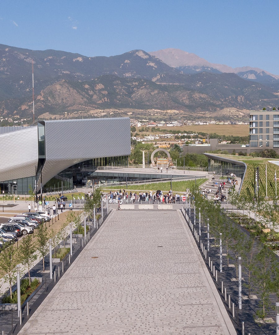 Aerial view of parking lot and walkway leading to the crowded US Olympic Museum