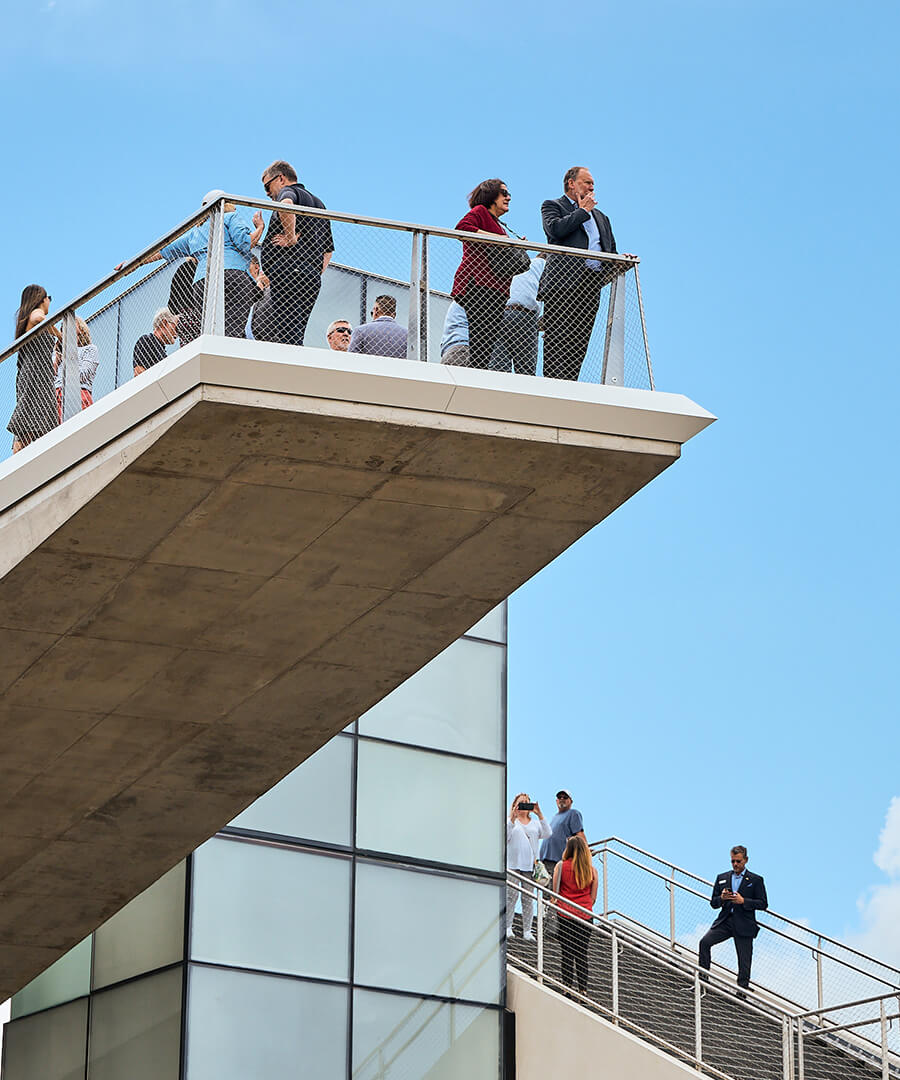 People standing on overlook on walking bridge at Park Union