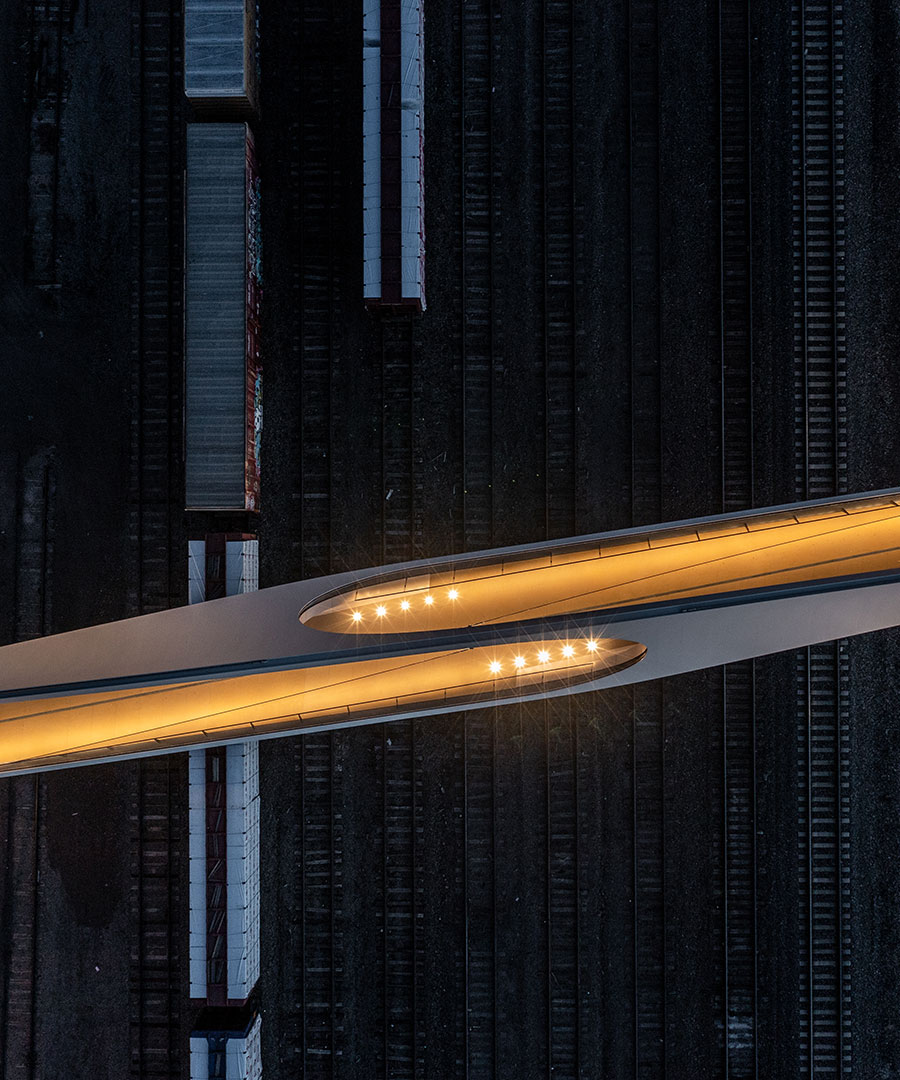 Aerial top-down shot of downtown walking bridge to American the Beautiful park
