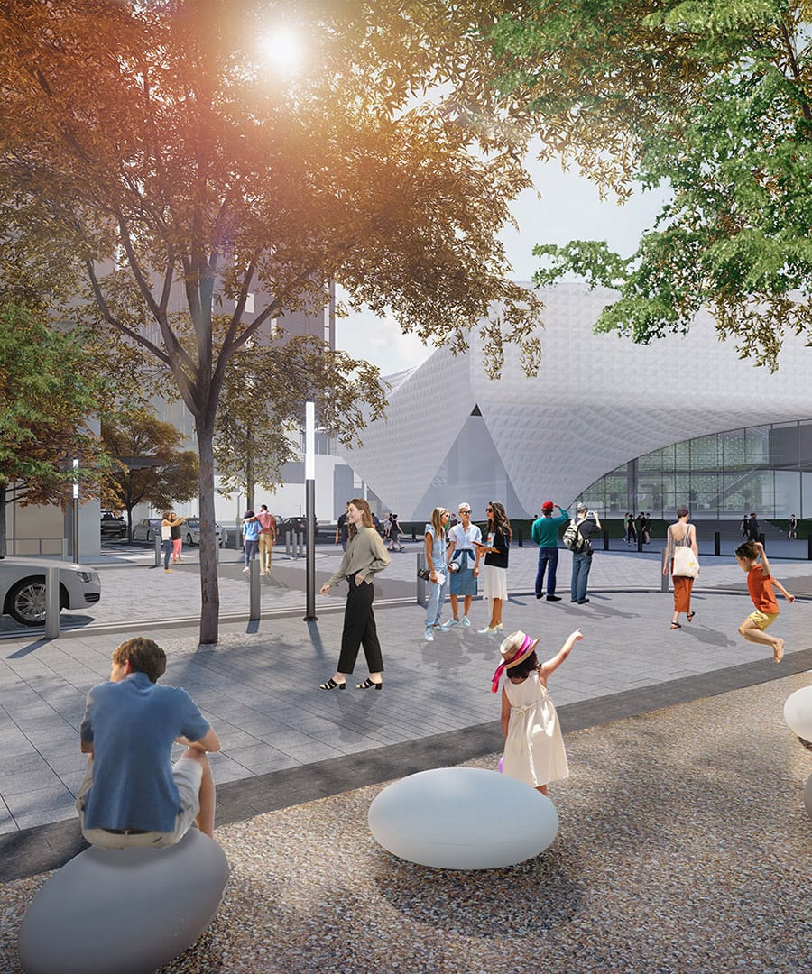 A crowd utilizes the area outside of the entrance of the US Olympic Museum