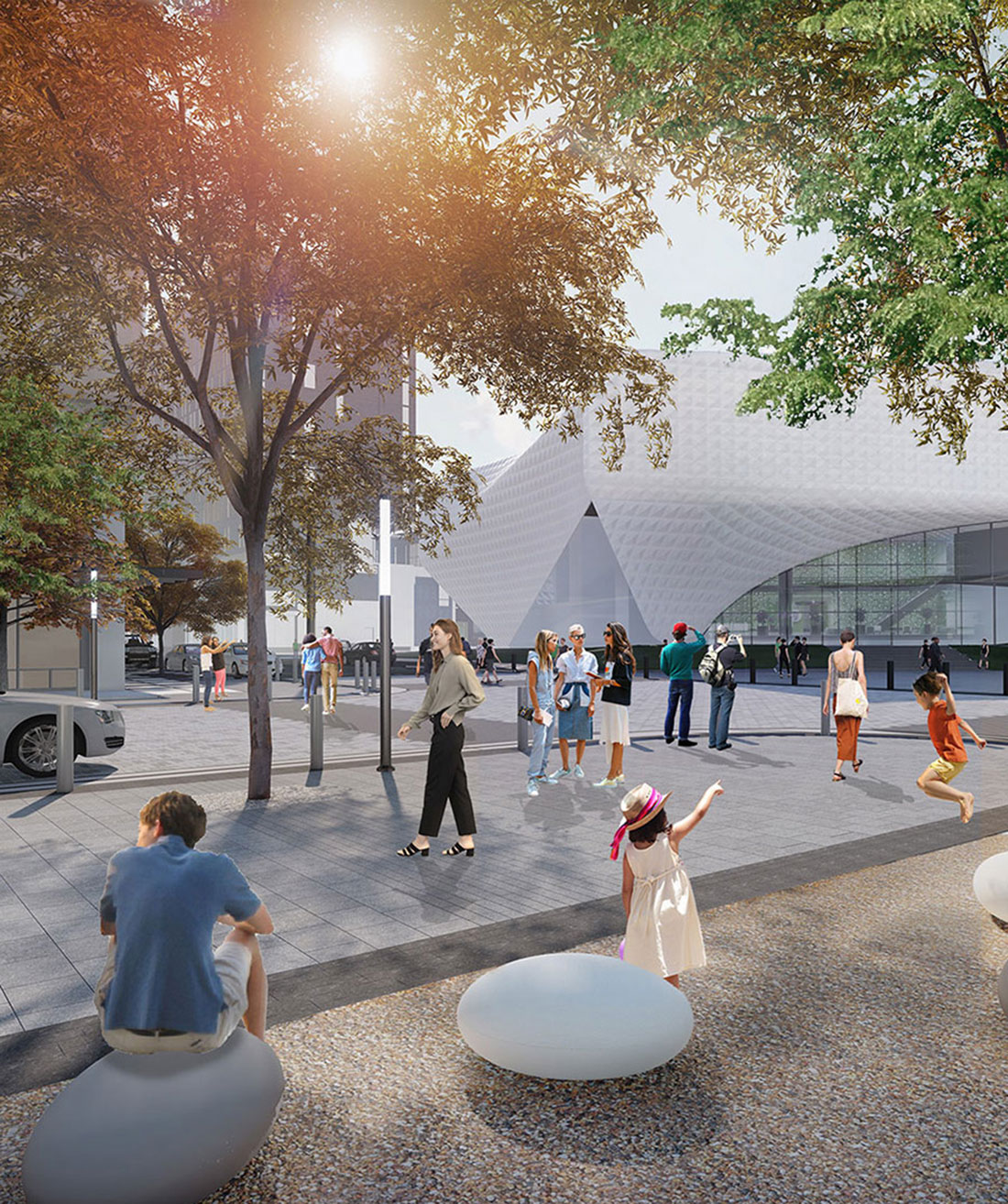 A crowd utilizes the area outside of the entrance of the US Olympic Museum